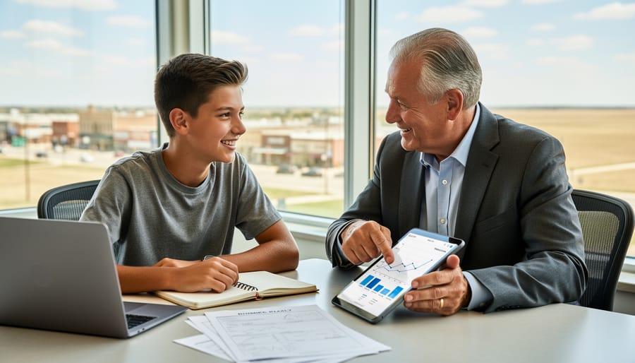 Youth founder and adult advisor reviewing an open notebook at a desk during a mentorship session.